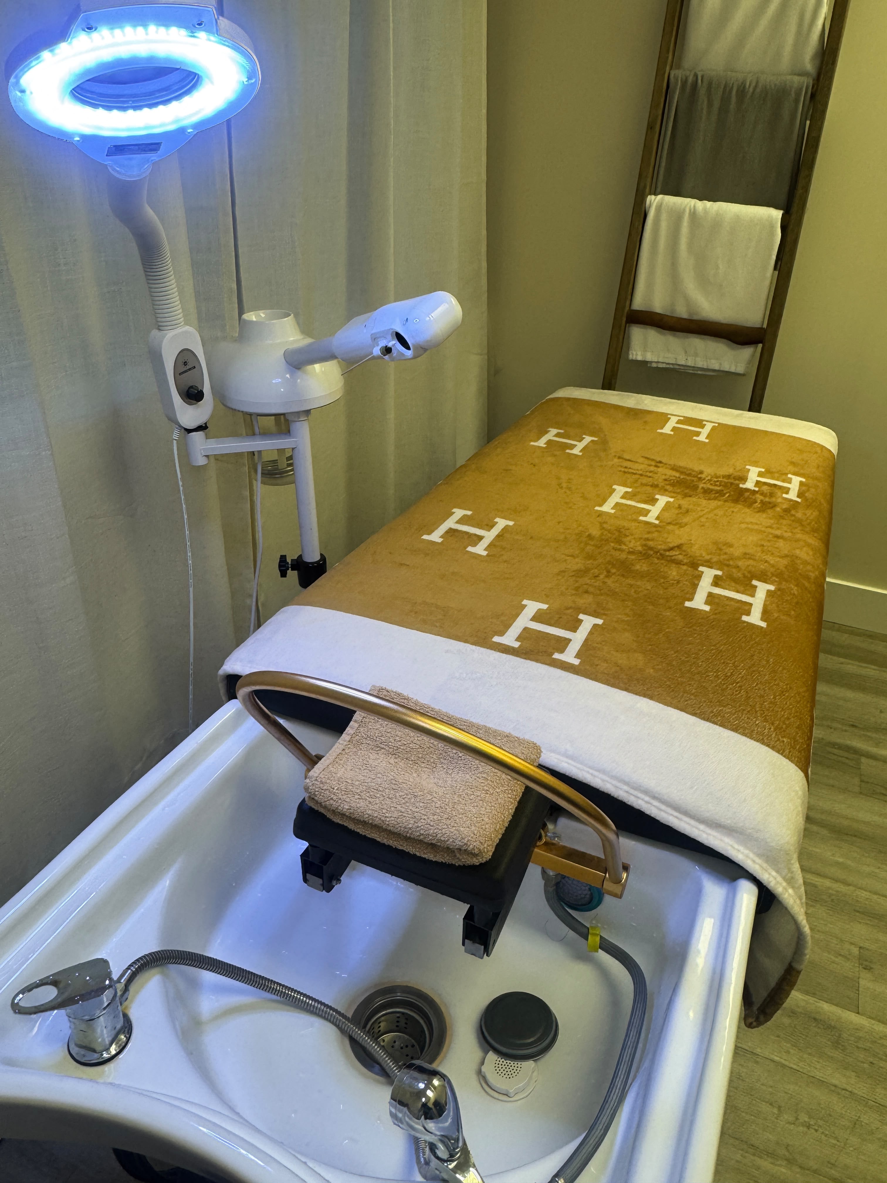 Facial treatment bed prepared for a visit